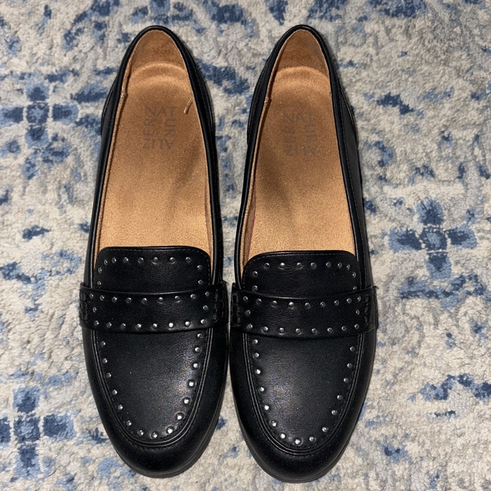 Black flats with stud detail